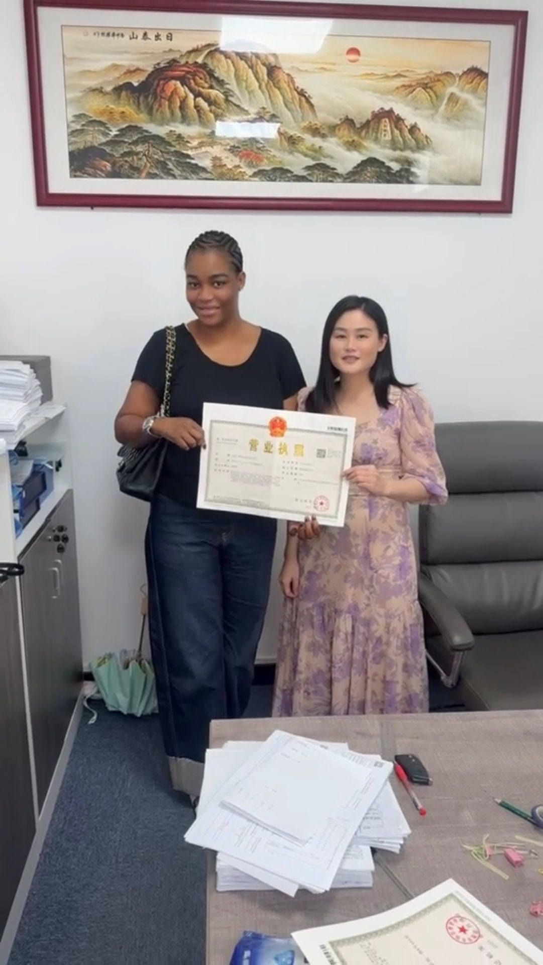Olisus Global Services receiving its Chinese business licence in Guangzhou